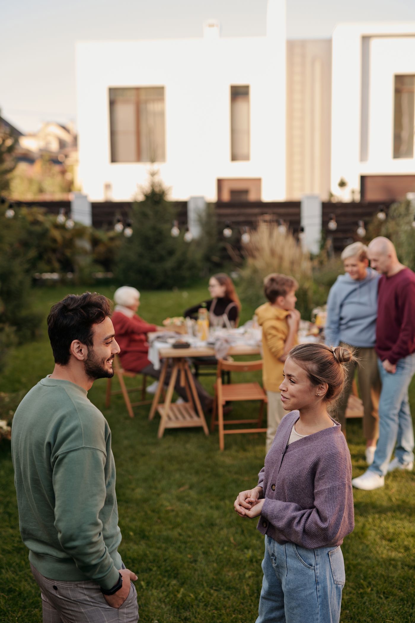 A multi-generational community gathering outdoors