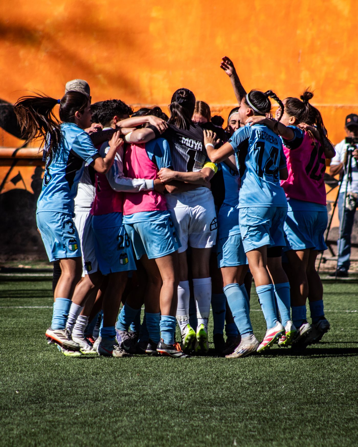 A youth sports team celebrating a win together
